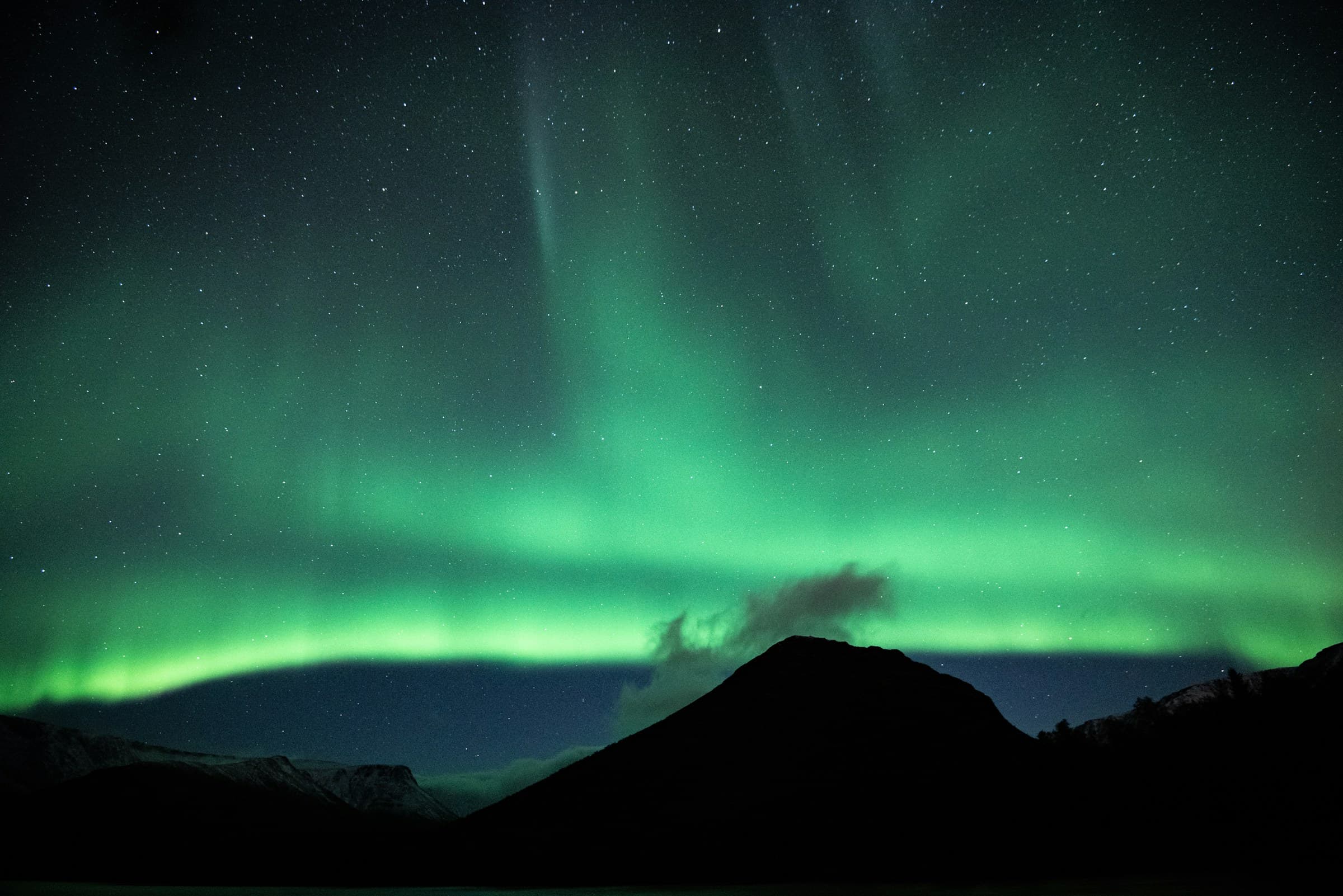 Green and blue aurora borealis in the night sky